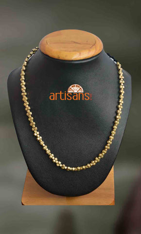 Tribal Jewellery:Golden colored necklace on black thread