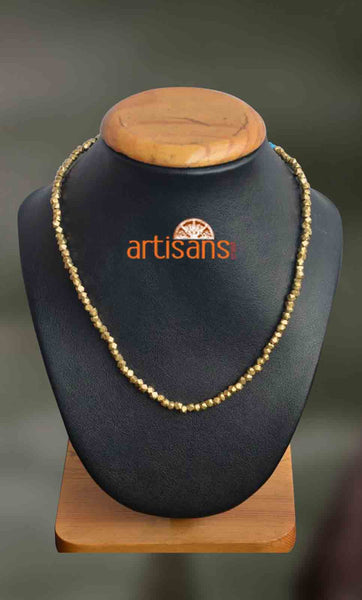 Tribal Jewellery:Golden colored necklace on black thread