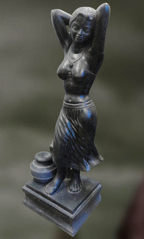 Blackstone sculpture of village maiden in a relaxed posture