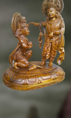 Wood sculpture of Krishna and arjuna