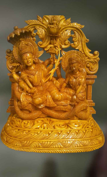 Wood sculpture of Laxmi and Narayan on Vasuki 