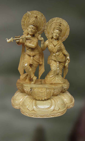 Wood sculpture of radha and krishna together 